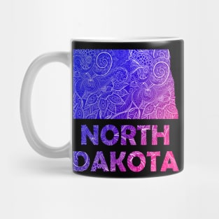 Colorful mandala art map of North Dakota with text in blue and violet Mug